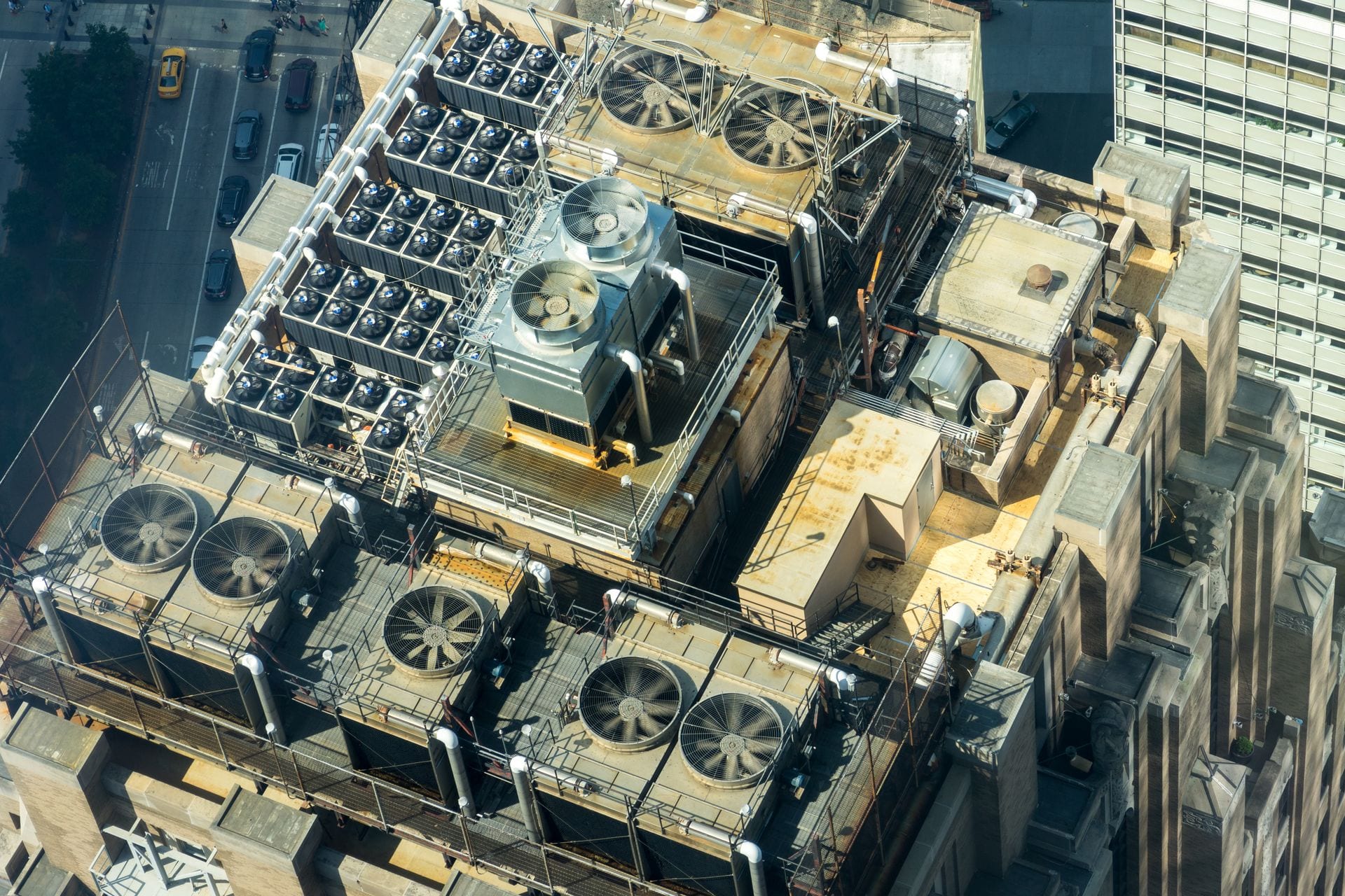 Rooftop commercial HVAC units against a clear sky