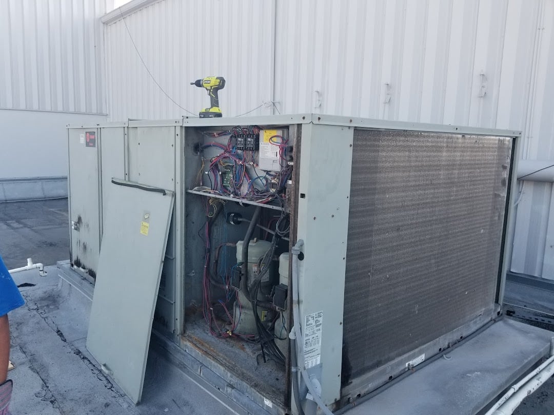 Jireh Cooler technician servicing a commercial rooftop package unit