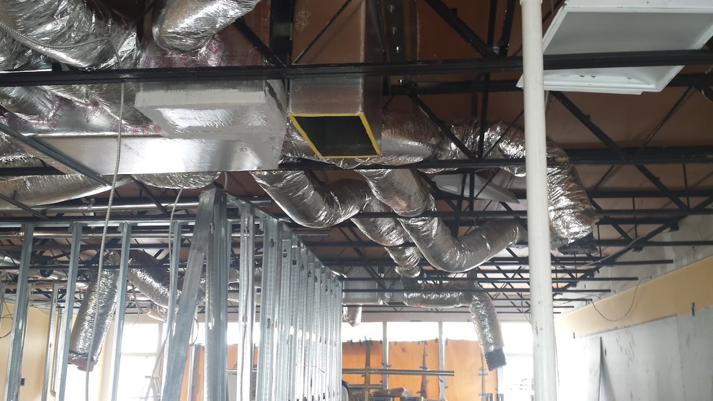 Ductwork installed by Jireh Cooler in a commercial building ceiling